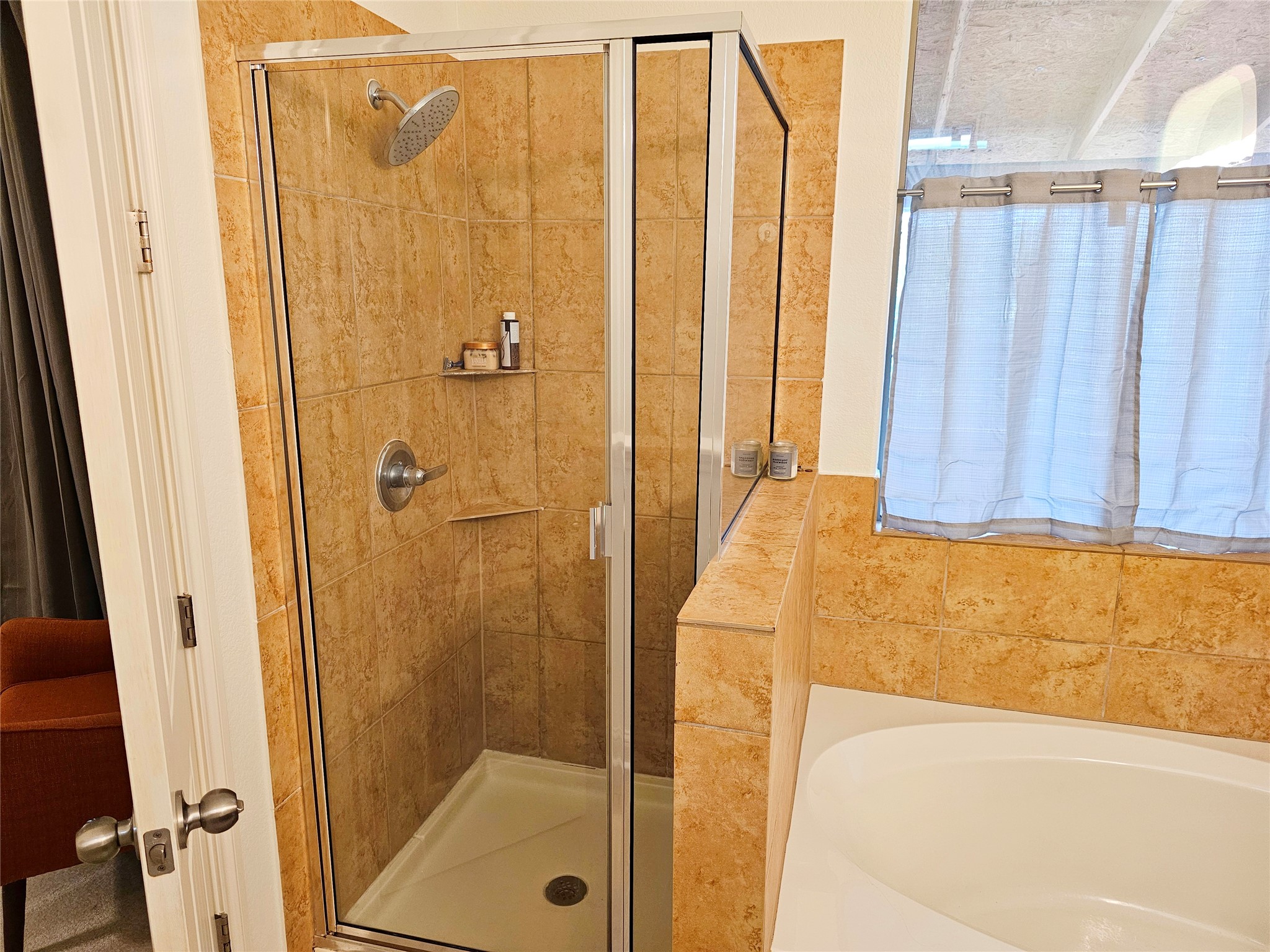 11508 Flushwing Drive Austin, TX 78754 - Photo 16 of 24 Bathroom featuring a garden tub and a shower stall