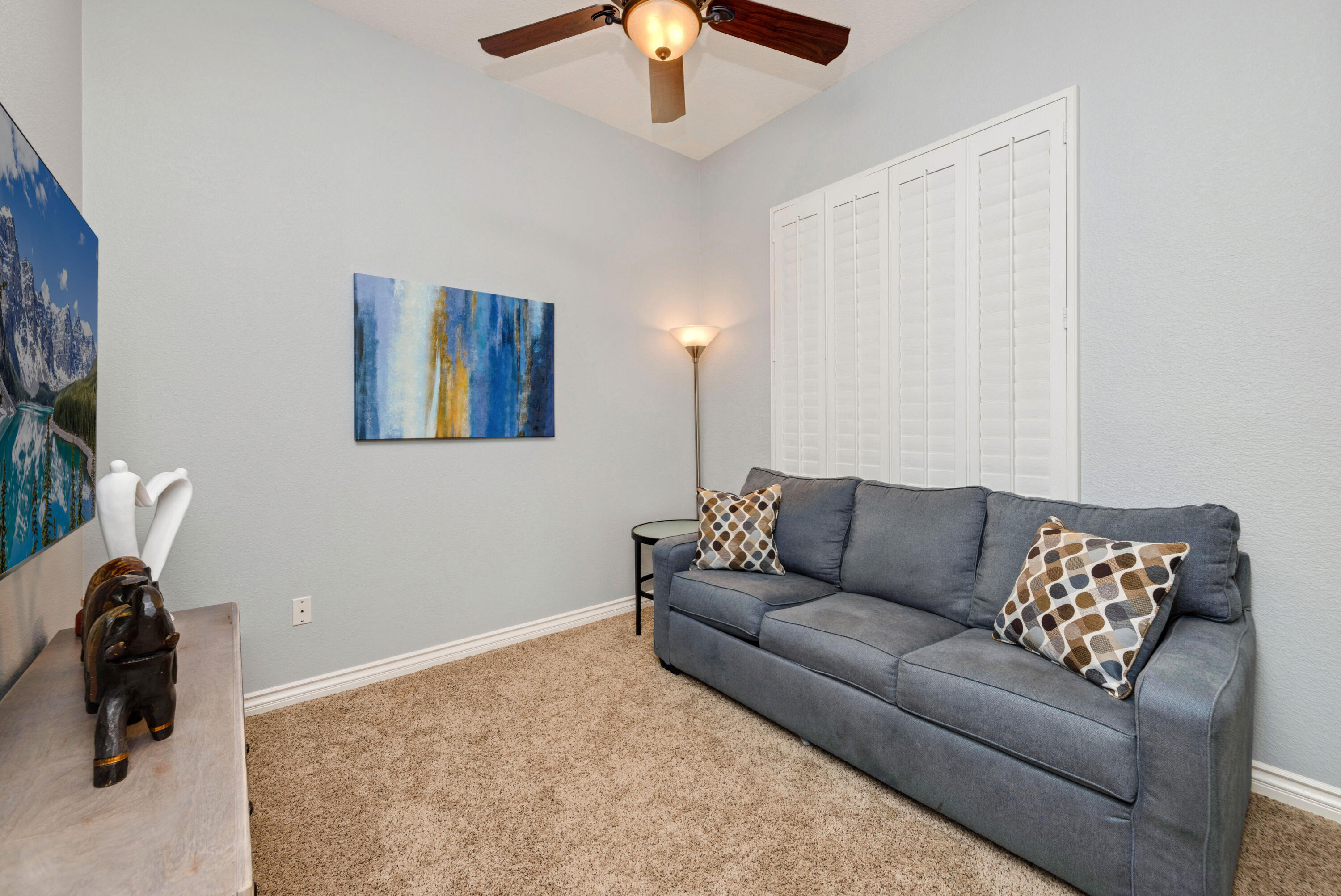 44357 Royal Lytham Drive Indio, CA 92201 - Photo 11 of 21 a living room with furniture and a lamp