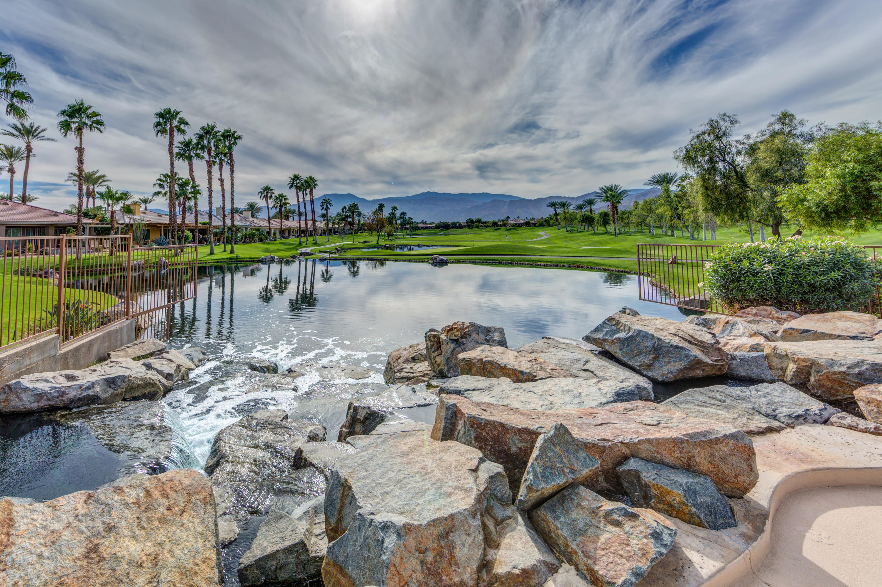 44357 Royal Lytham Drive Indio, CA 92201 - Photo 14 of 21 a view of a lake with couches chairs