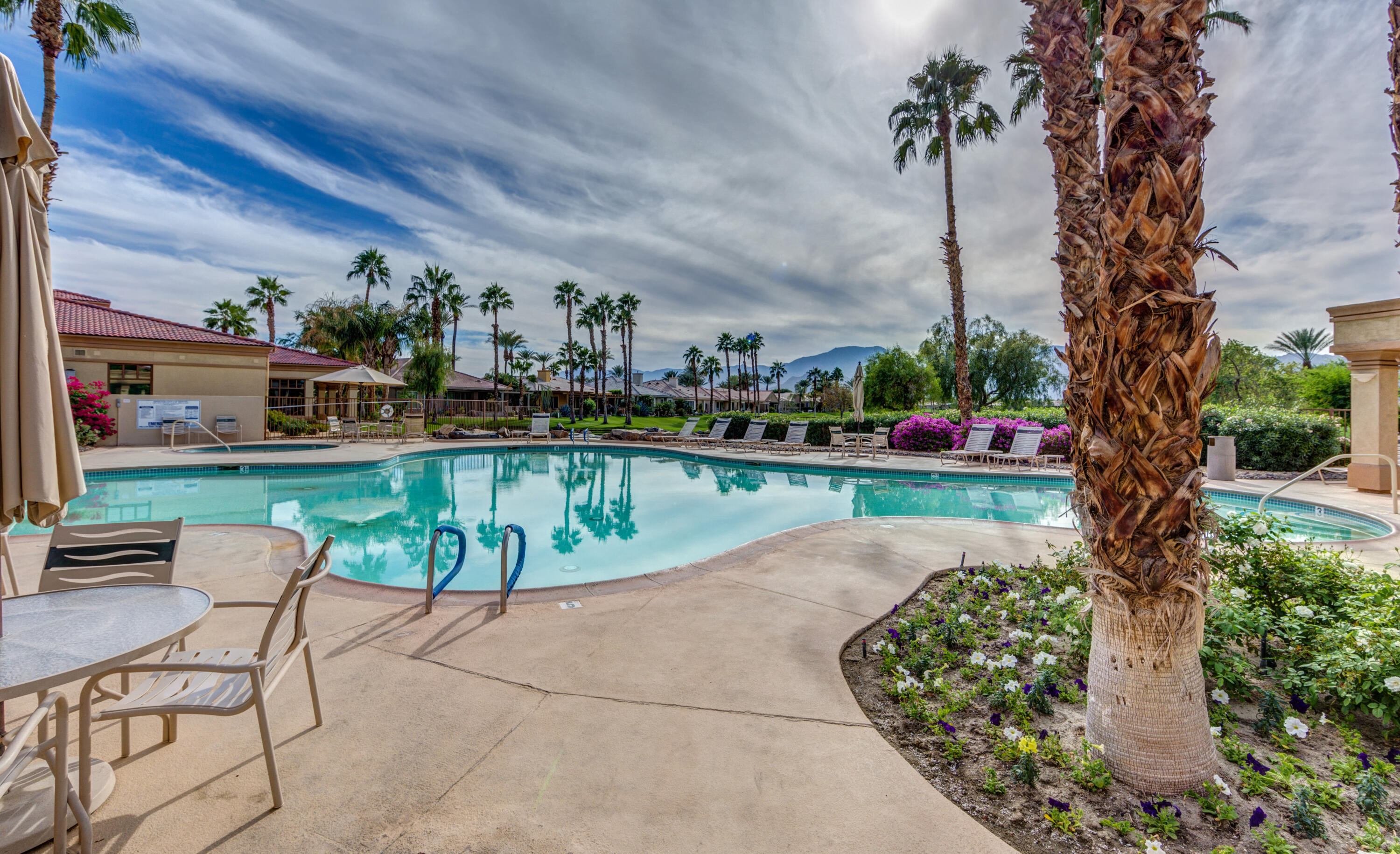 44357 Royal Lytham Drive Indio, CA 92201 - Photo 17 of 21 a swimming pool with outdoor seating and yard