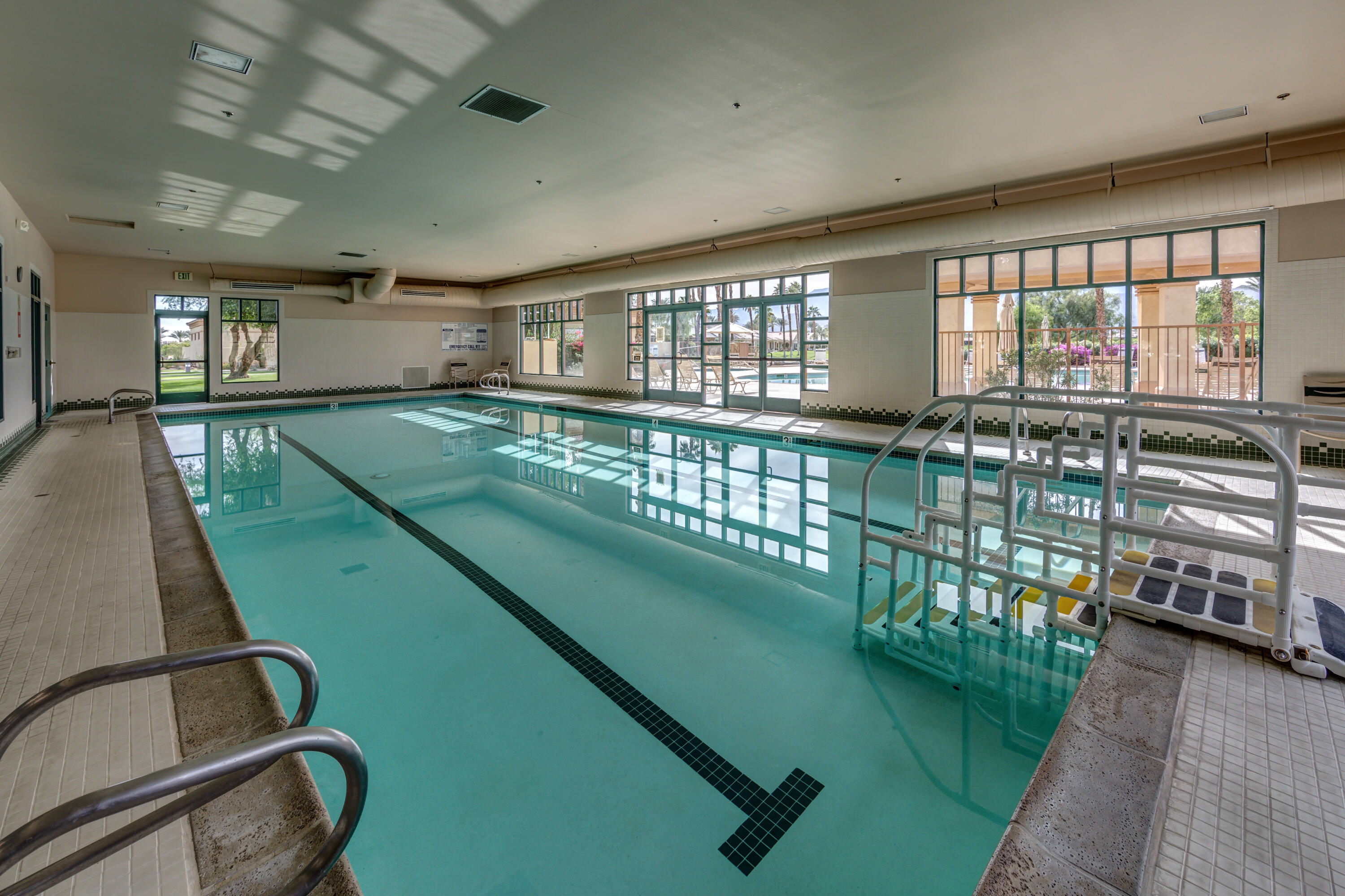 44357 Royal Lytham Drive Indio, CA 92201 - Photo 18 of 21 a view of a swimming pool and outdoor seating