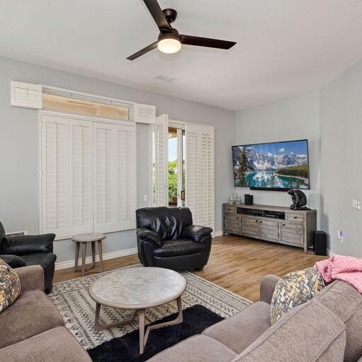 44357 Royal Lytham Drive Indio, CA 92201 - Photo 4 of 21 a living room with furniture and a flat screen tv
