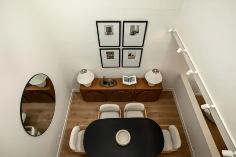 a bathroom with a toilet and a mirror