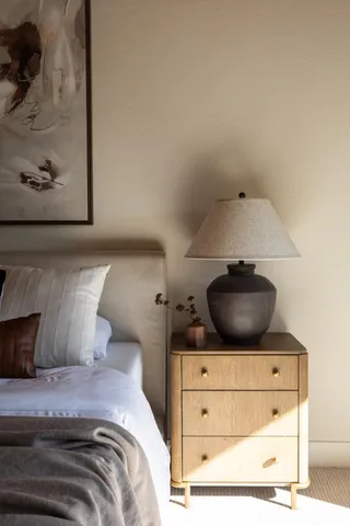a bedroom with a bed and a dresser