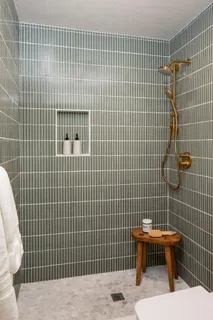 a bathroom with a toilet sink and shower