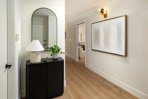 a view of a bathroom with a sink and mirror