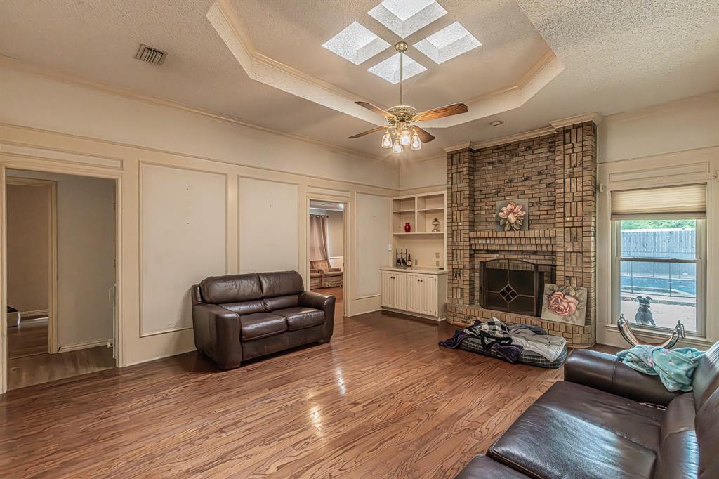 3309 Timber View Circle Bedford, TX 76021 - Photo 5 of 38 a living room with furniture and a fireplace
