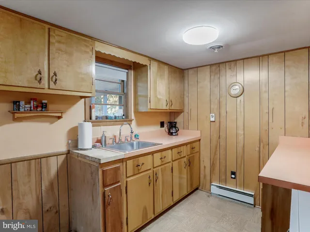 a bedroom with a bed and a curtain