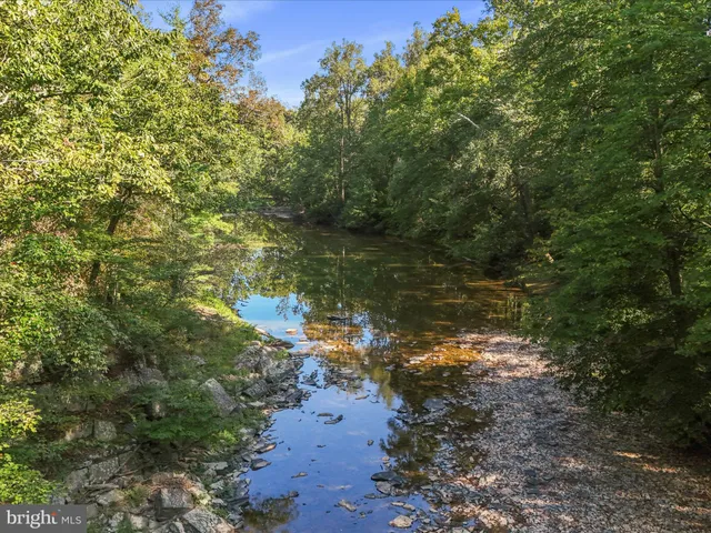 a view of a lake with mountains in the background
