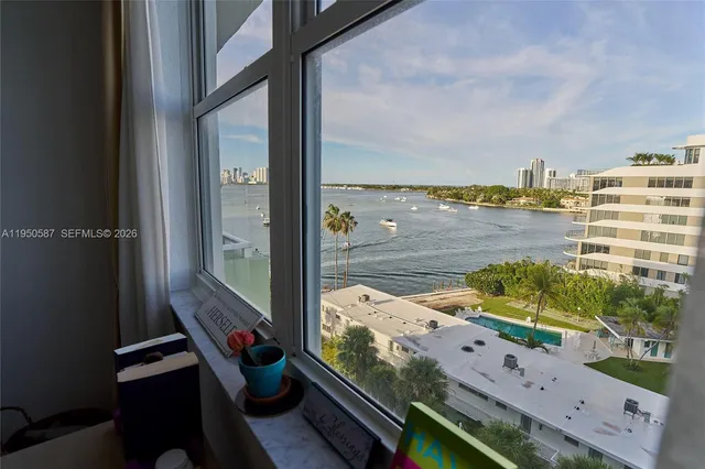 a view of a swimming pool a yard and a fountain