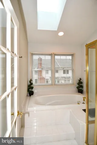 a bathroom with a bathtub and a shower