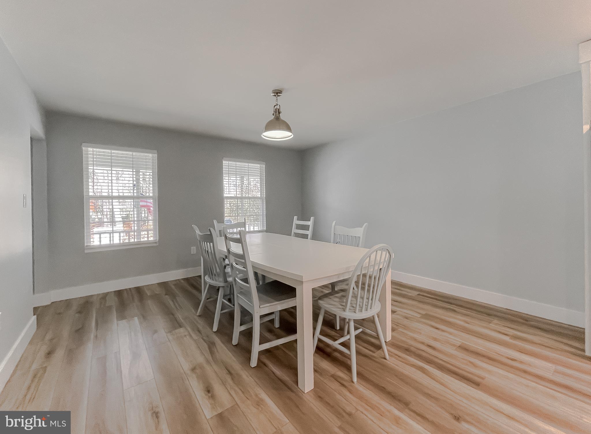 13630 Dowell Road Solomons, MD 20657 - Photo 104 of 121 a view of a dining room with furniture window and wooden floor