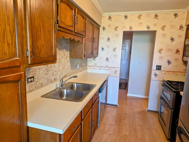 a kitchen with a stove and a microwave