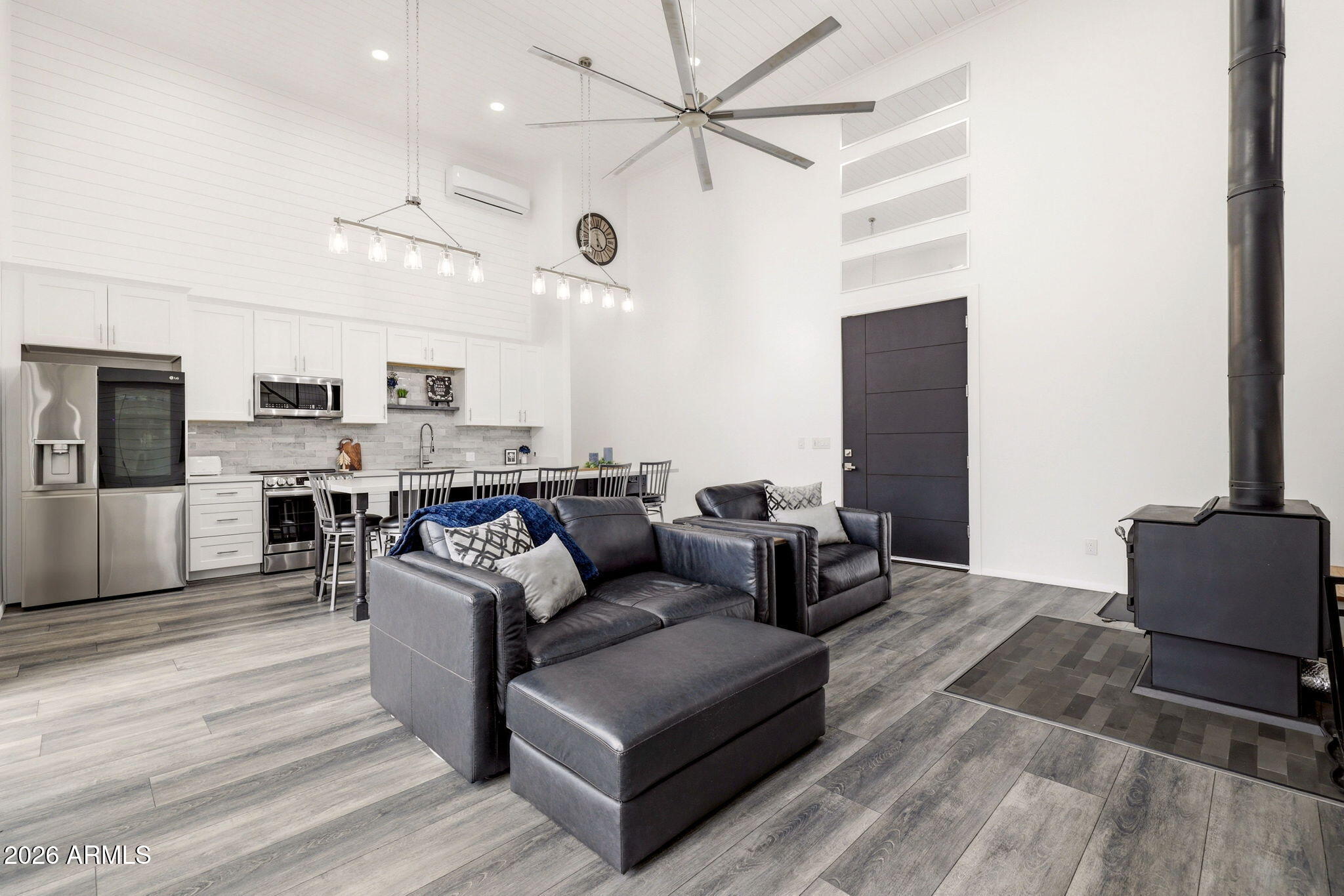 2287 Richenbacher Circle Overgaard, AZ 85933 - Photo 11 of 46 a living room with furniture kitchen view and a chandelier