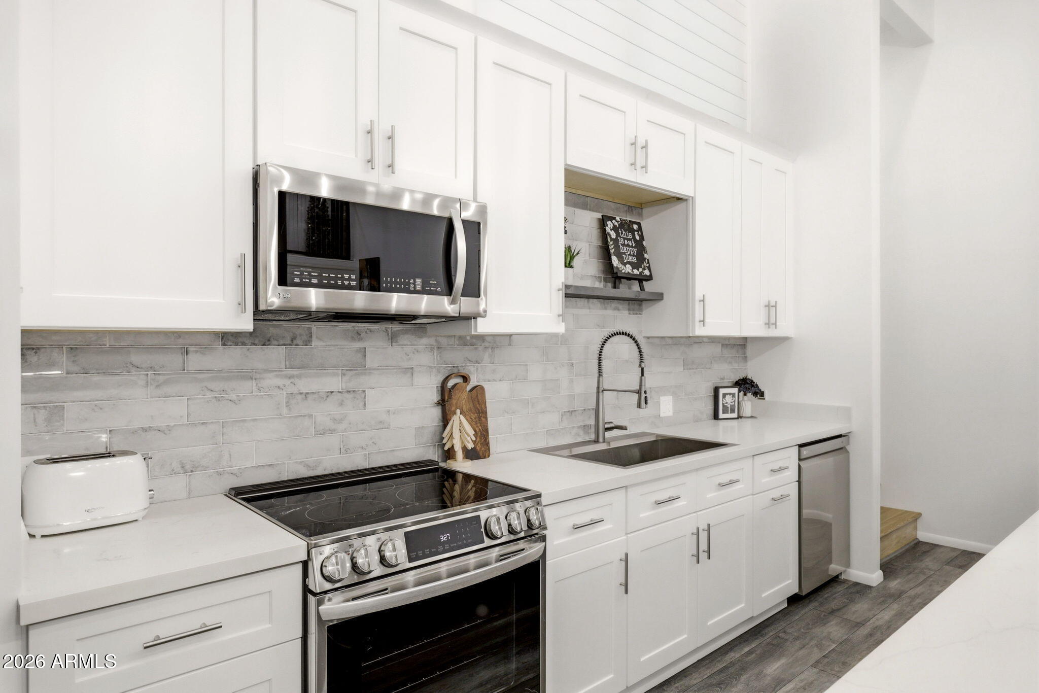 2287 Richenbacher Circle Overgaard, AZ 85933 - Photo 14 of 46 a kitchen with appliances a sink and cabinets