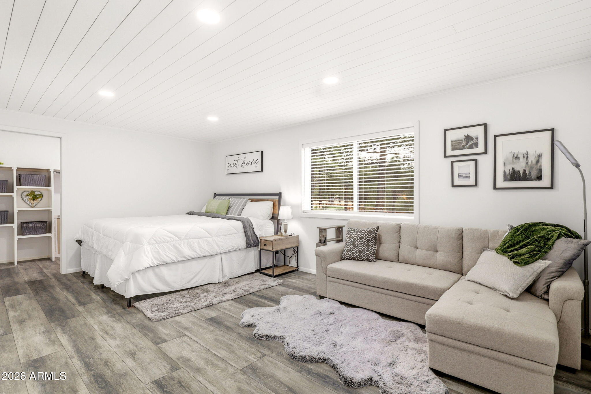 2287 Richenbacher Circle Overgaard, AZ 85933 - Photo 15 of 46 a bedroom with a bed couch and window