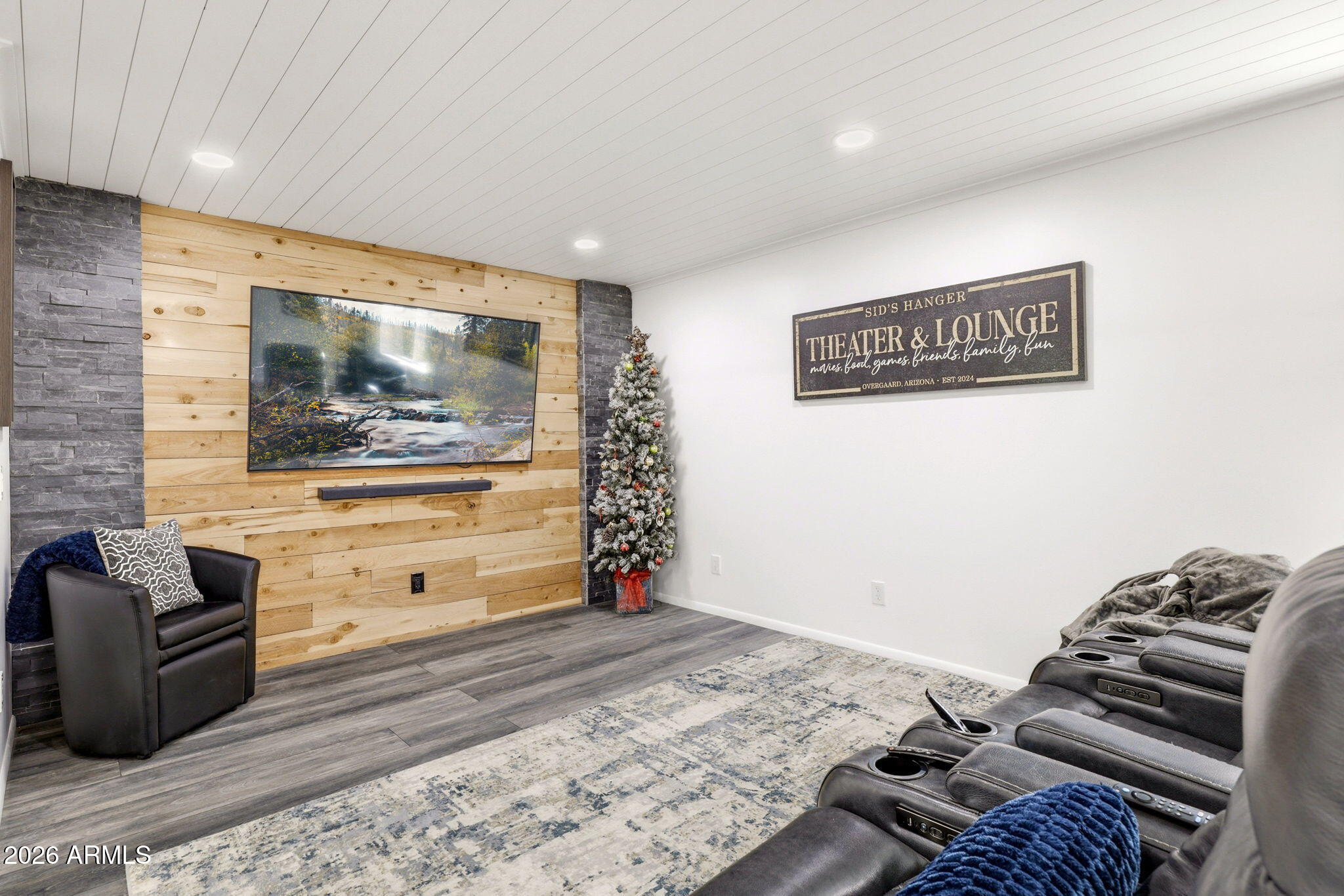 2287 Richenbacher Circle Overgaard, AZ 85933 - Photo 20 of 46 a bedroom with a bed and wooden floor