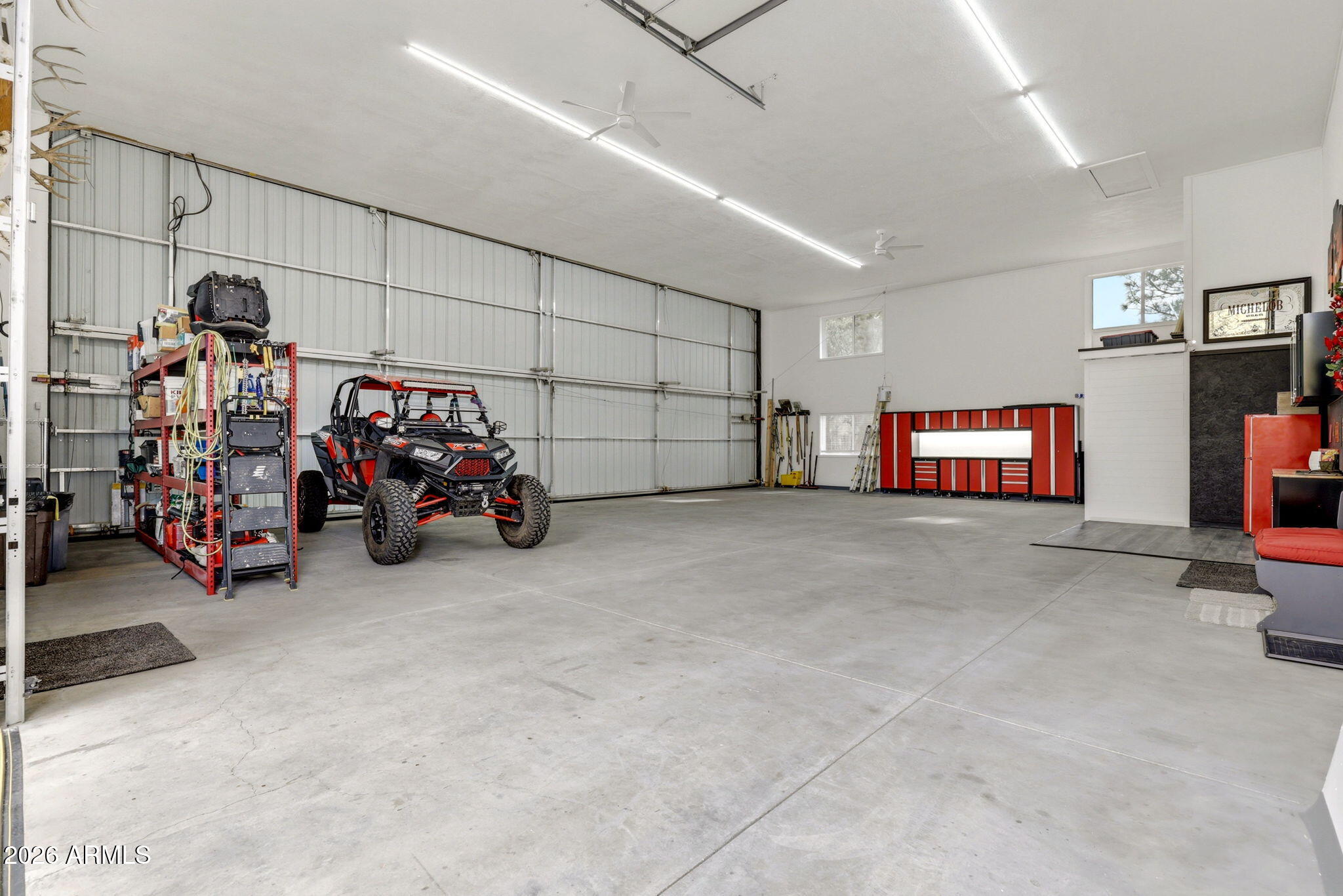 2287 Richenbacher Circle Overgaard, AZ 85933 - Photo 32 of 46 a view of a garage with rack and bicycle
