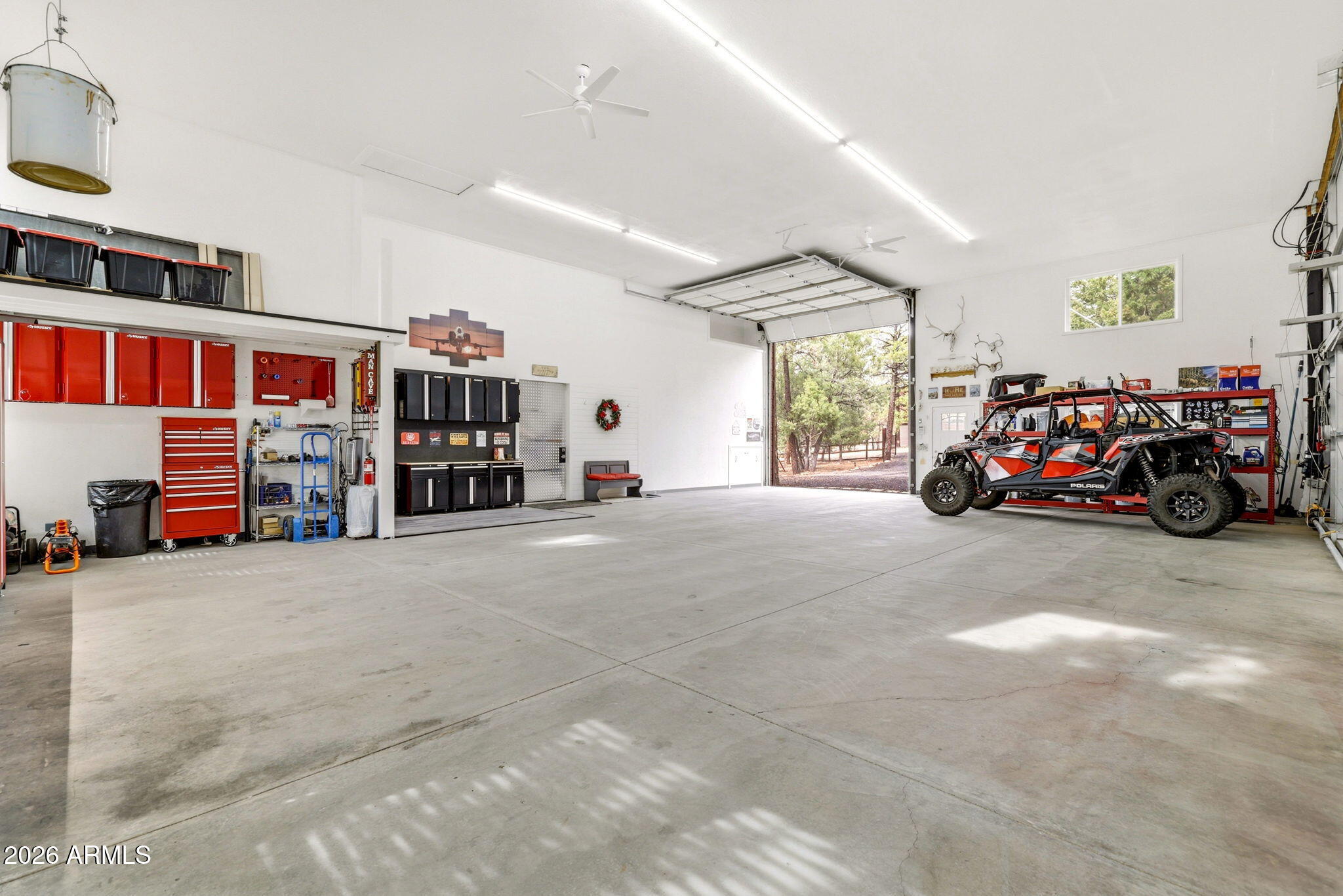 2287 Richenbacher Circle Overgaard, AZ 85933 - Photo 34 of 46 a bedroom with furniture and a large window