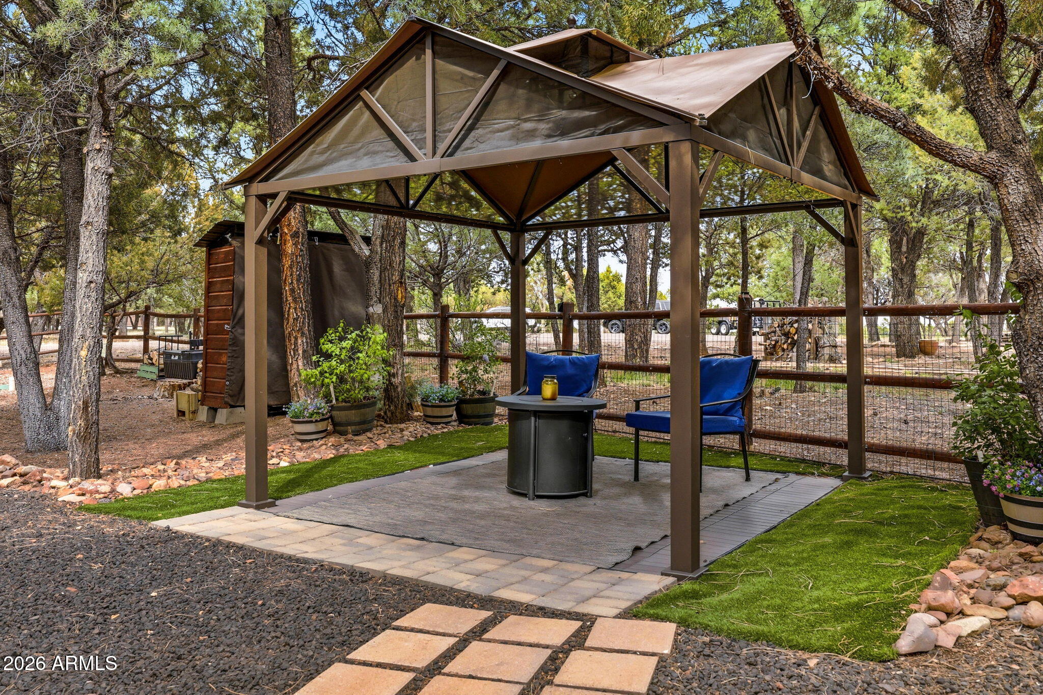 2287 Richenbacher Circle Overgaard, AZ 85933 - Photo 36 of 46 a view of a chairs and table in the patio