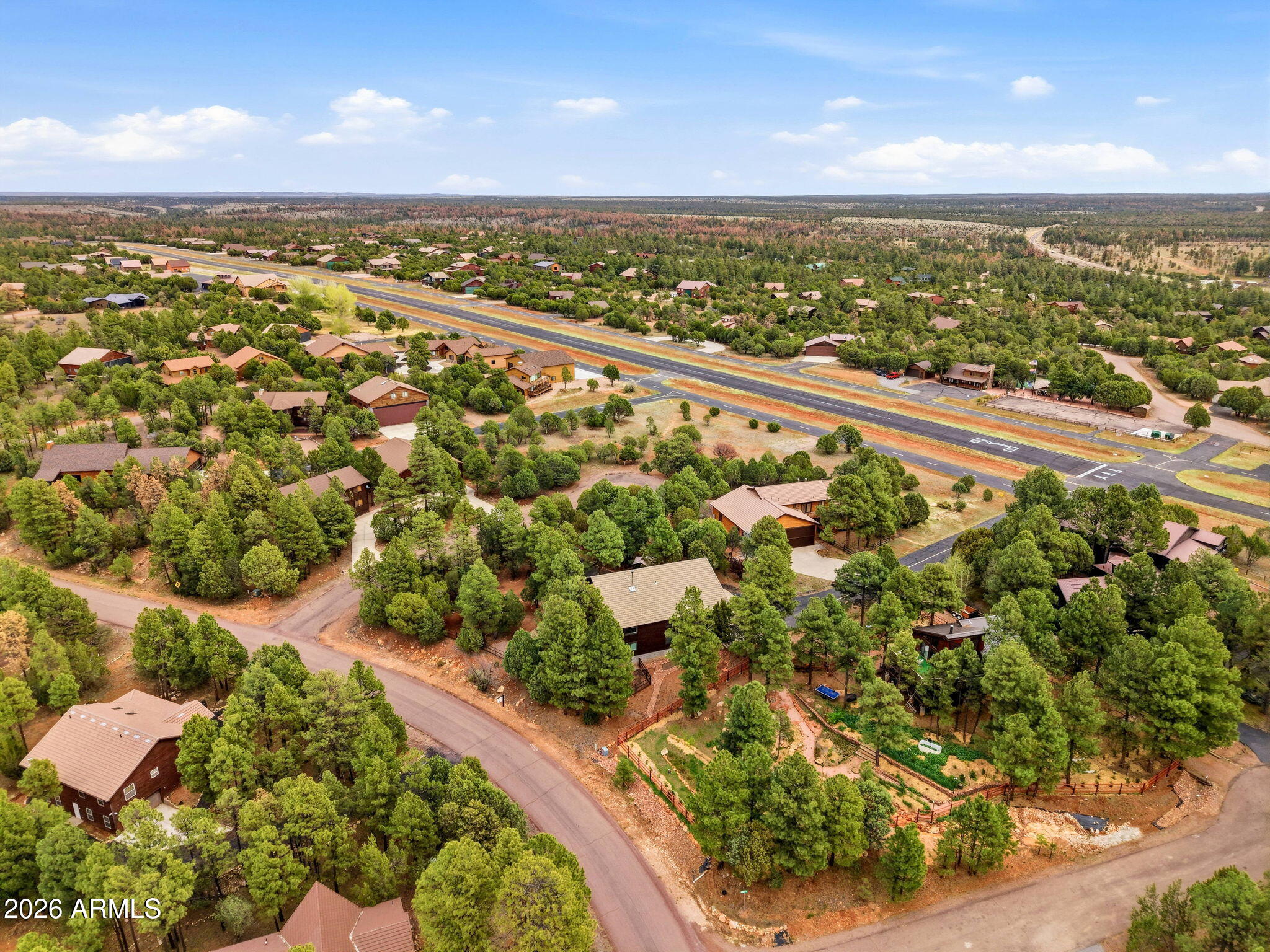 2287 Richenbacher Circle Overgaard, AZ 85933 - Photo 43 of 46 an aerial view of residential houses with outdoor space