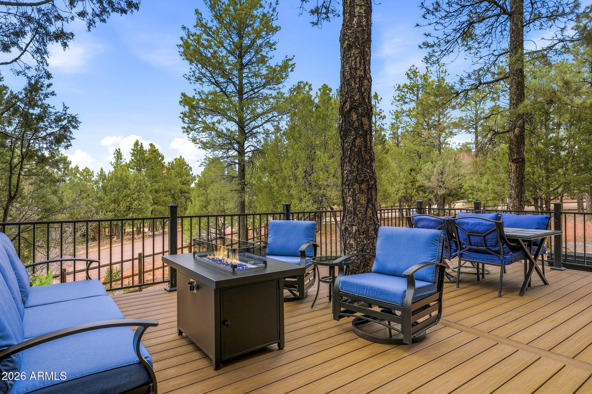 2287 Richenbacher Circle Overgaard, AZ 85933 - Photo 6 of 46 a view of a chairs on deck with wooden floor and fence