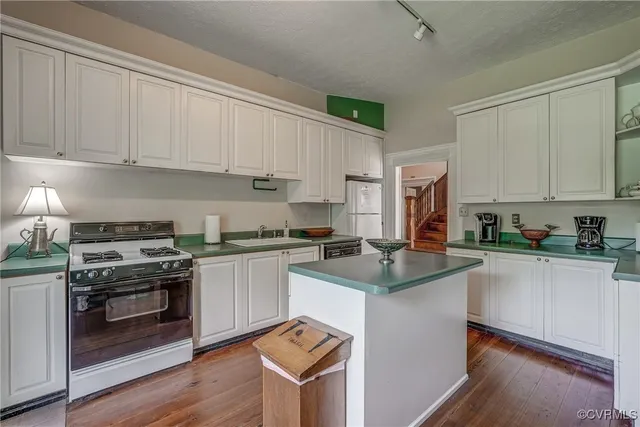 a bedroom with a bed and a fireplace