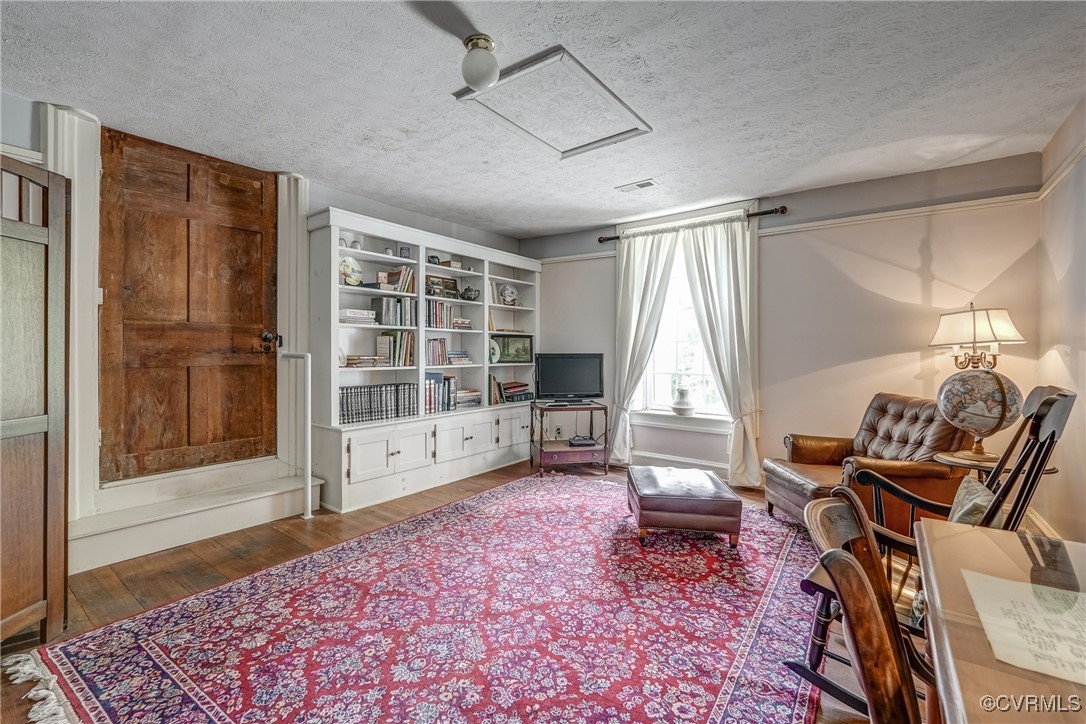 23 Courthouse Road Buckingham, VA 23921 - Photo 29 of 50 a living room with furniture a flat screen tv and a fireplace