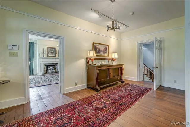 a view of a bedroom with furniture window and front door