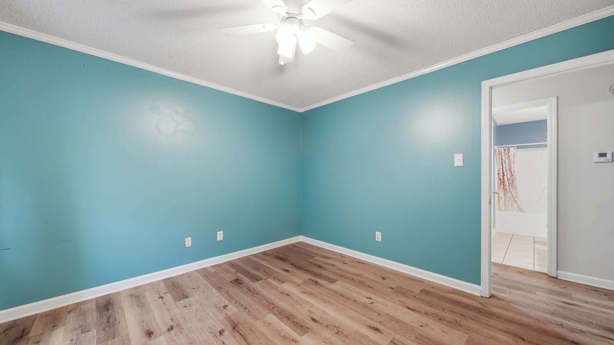 217 Rae Drive Munford, TN 38058 - Photo 25 of 40 Room with wood-finish flooring, white baseboards, and a ceiling fan