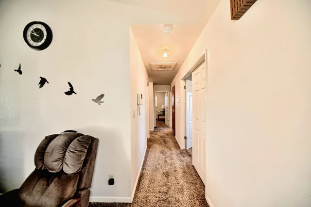 a kitchen with stainless steel appliances granite countertop a sink and wooden cabinets