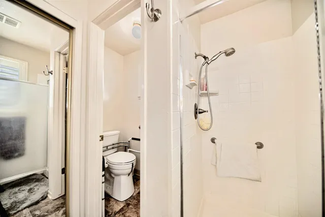 a view of a hallway with a living room