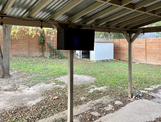 a view of a porch with a tree
