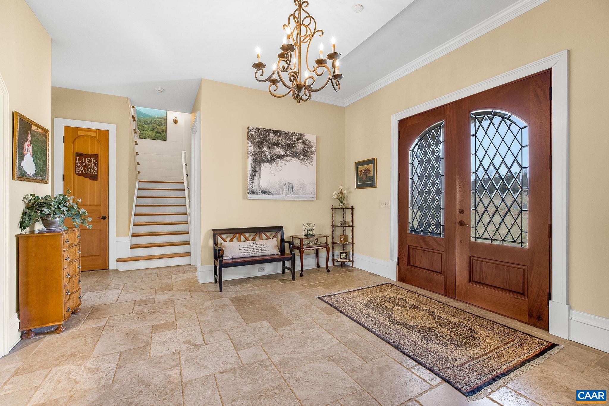 2687 Milton Farm Charlottesville, VA 22902 - Photo 46 of 75 a view of a hallway with furniture and a chandelier