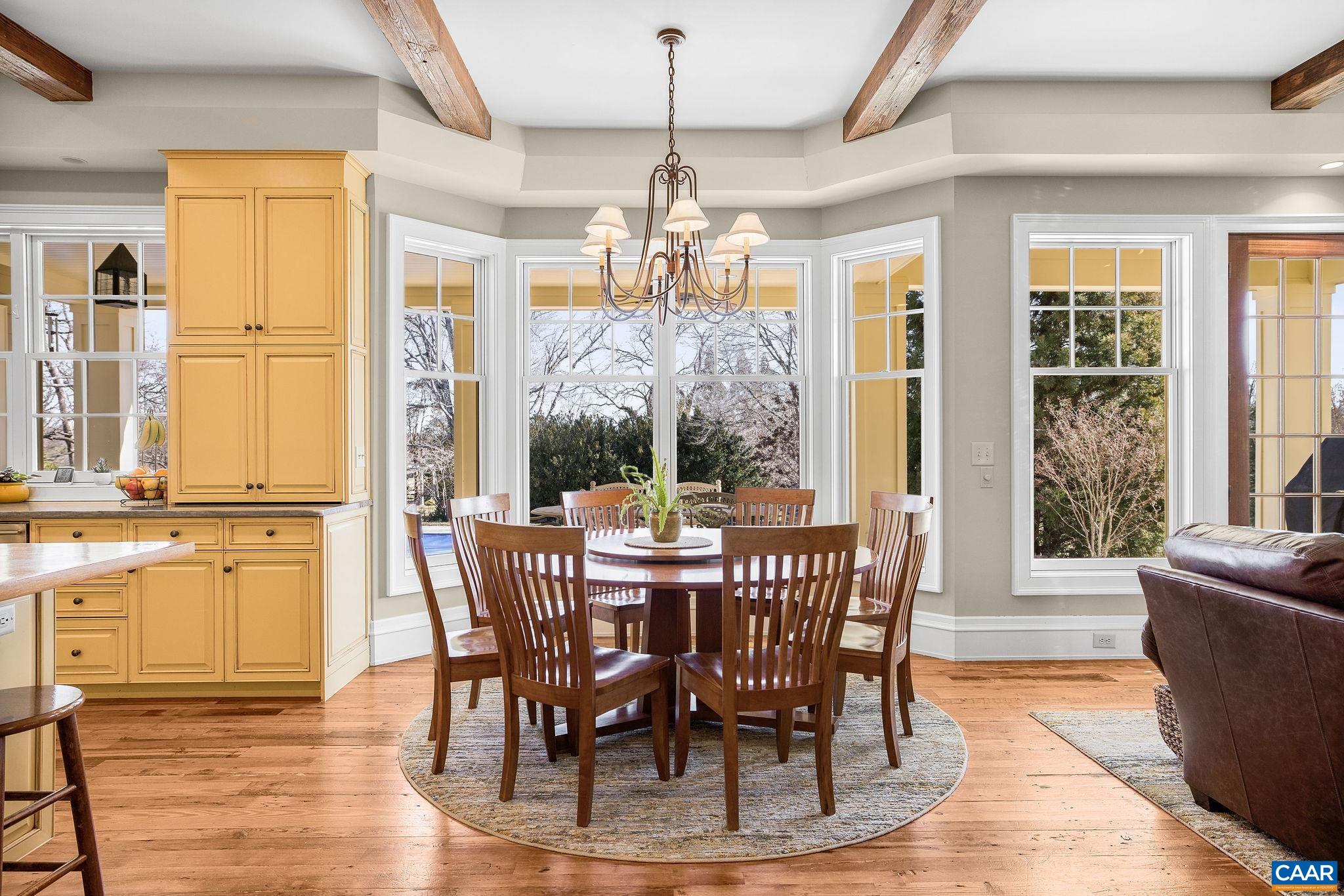 2687 Milton Farm Charlottesville, VA 22902 - Photo 51 of 75 a view of a dining room with furniture large windows and wooden floor