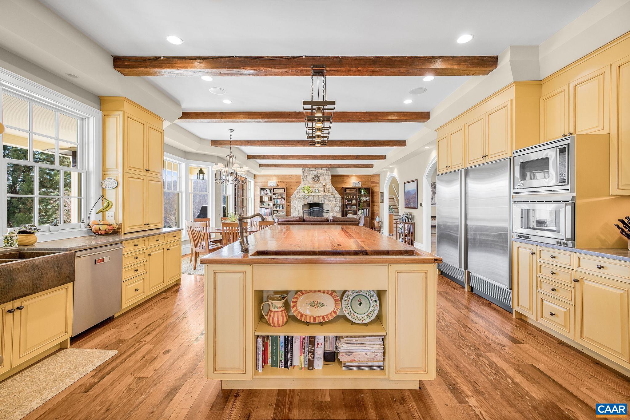 2687 Milton Farm Charlottesville, VA 22902 - Photo 53 of 75 a kitchen with stainless steel appliances granite countertop a stove and a refrigerator