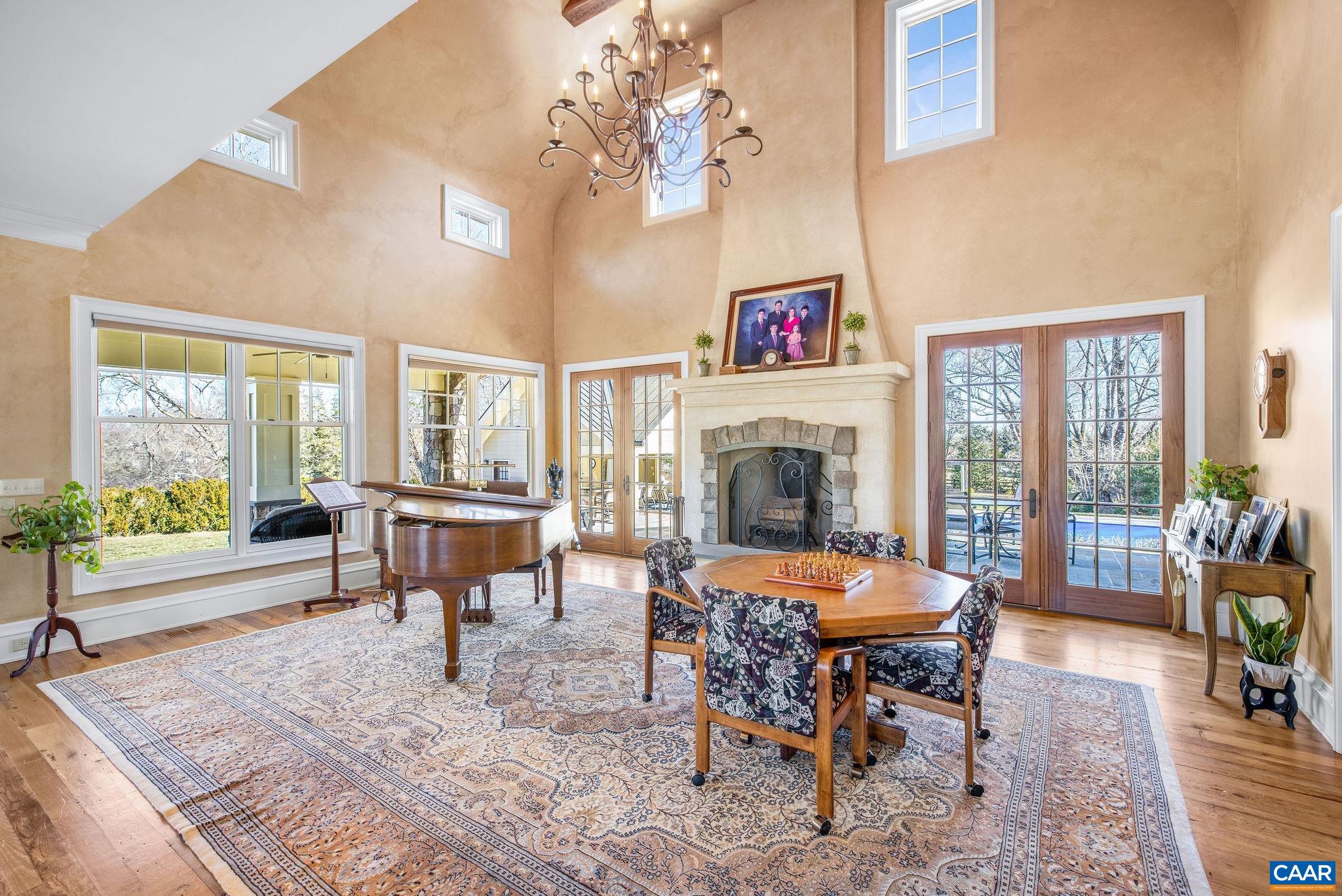 2687 Milton Farm Charlottesville, VA 22902 - Photo 61 of 75 a living room with furniture a fireplace and a table