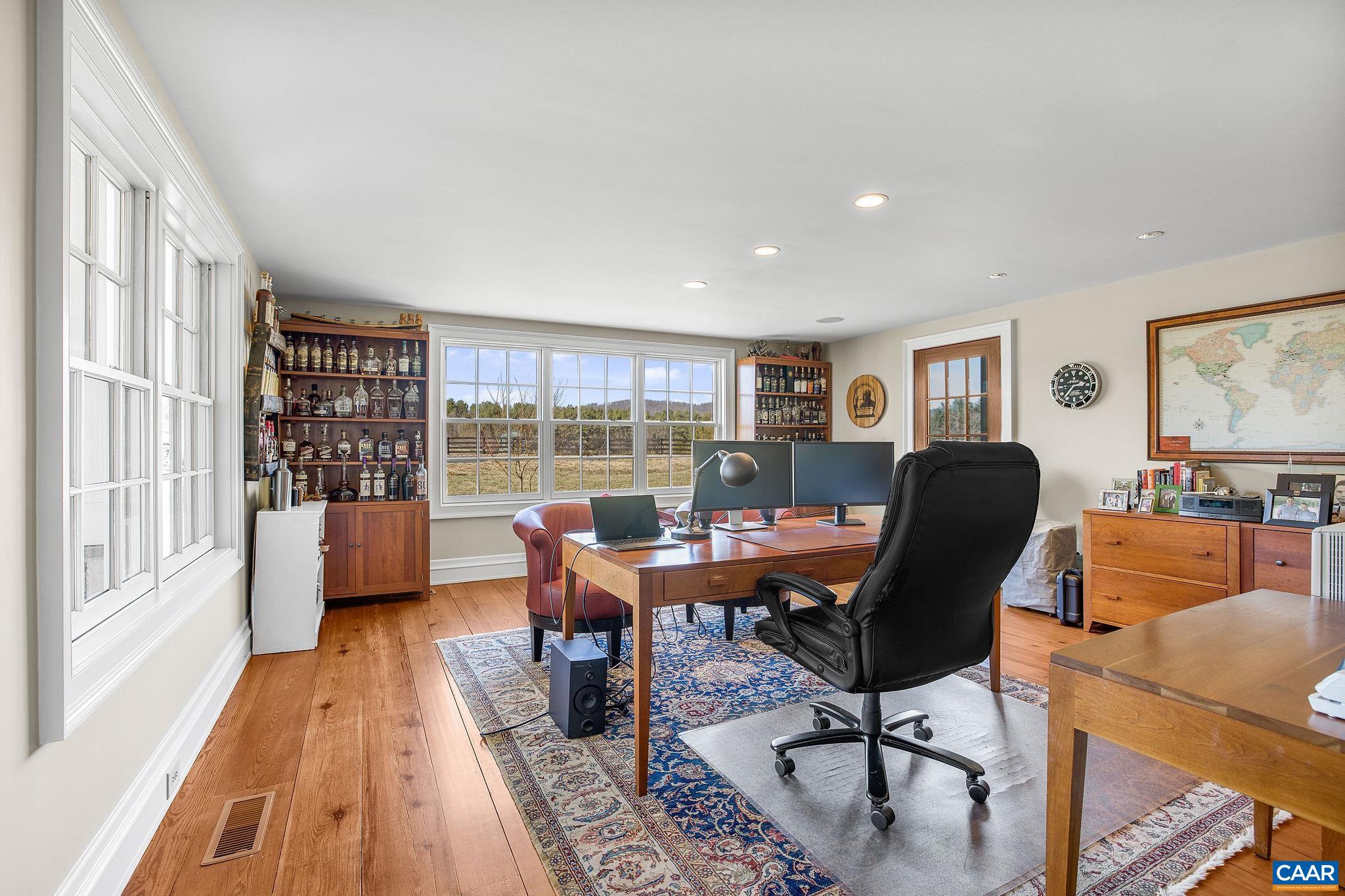 2687 Milton Farm Charlottesville, VA 22902 - Photo 64 of 75 a view of a workspace with furniture and a window