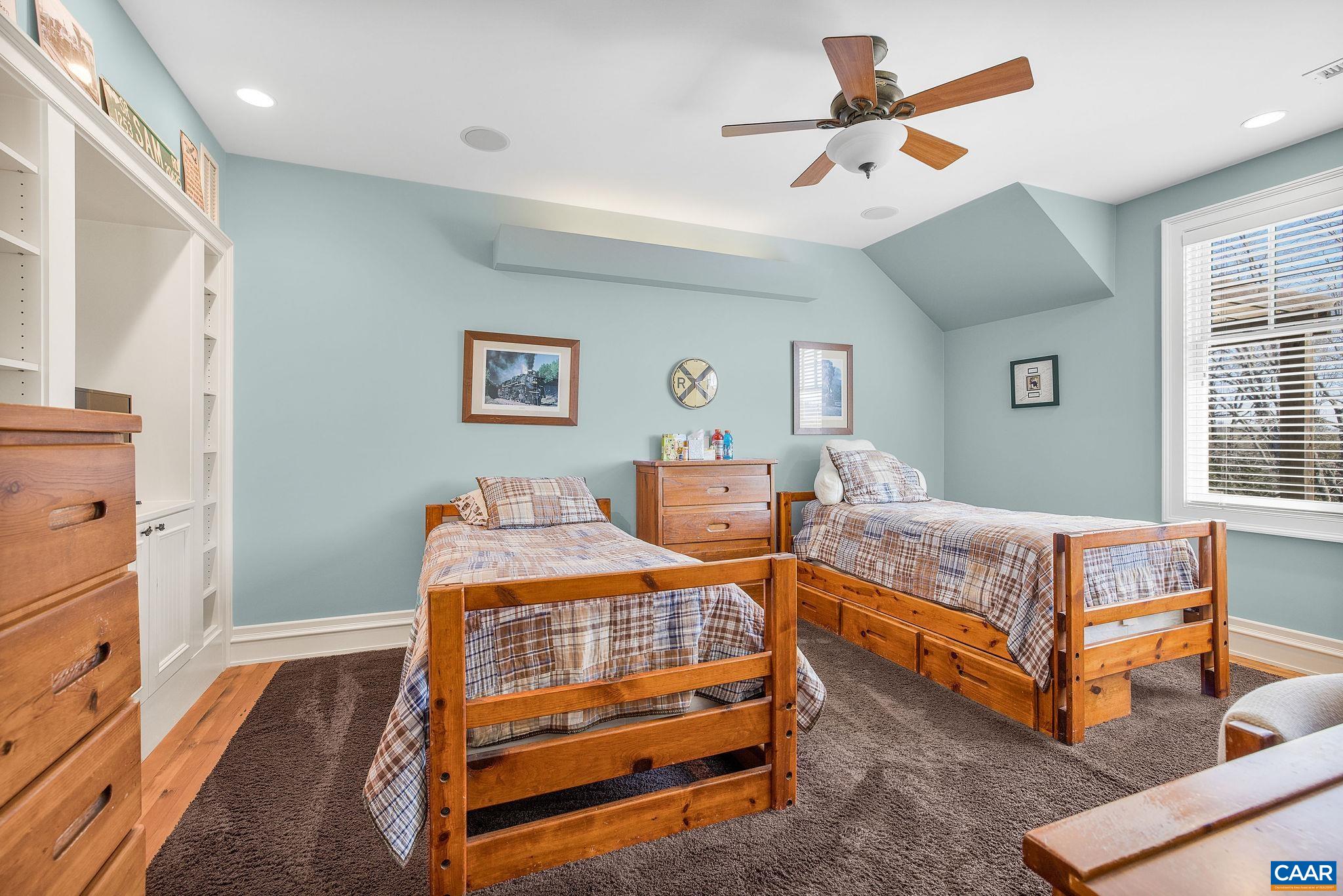 2687 Milton Farm Charlottesville, VA 22902 - Photo 72 of 75 a bedroom with a bed and a chandelier