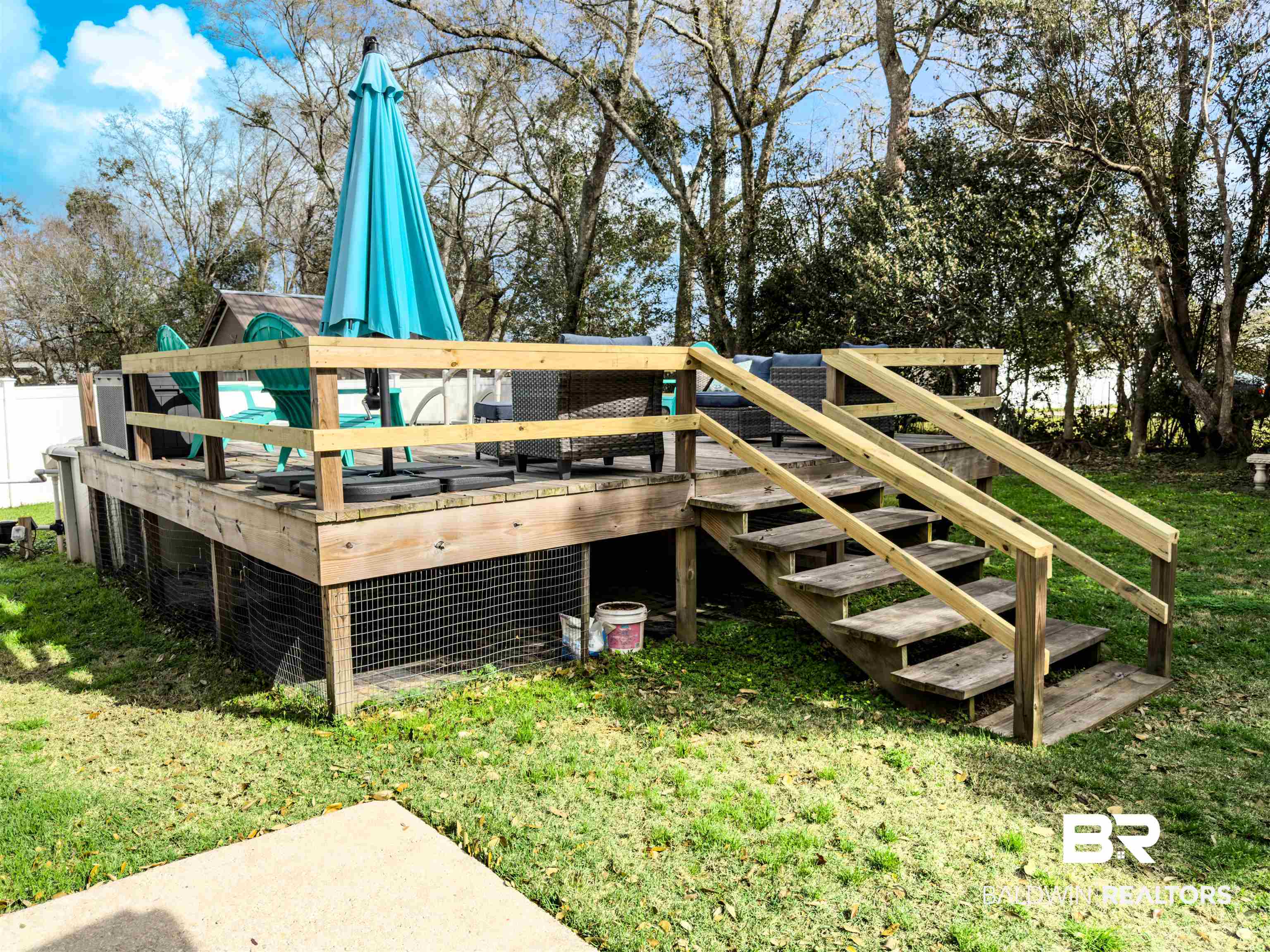 129 Pennbrooke Loop Foley, AL 36535 - Photo 34 of 44 Wooden deck featuring a lawn, exterior structure, and an outdoor structure