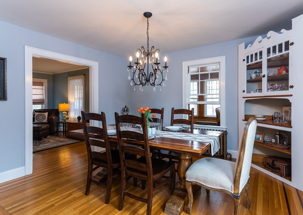 93 Gould Road Andover, MA 01810 - Photo 11 of 39 a view of a dining room with furniture and wooden floor