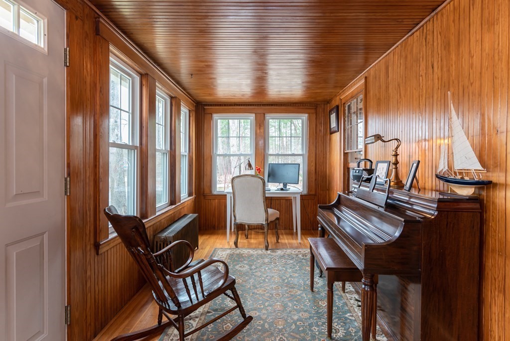 93 Gould Road Andover, MA 01810 - Photo 15 of 39 a living room with furniture a fireplace and large windows