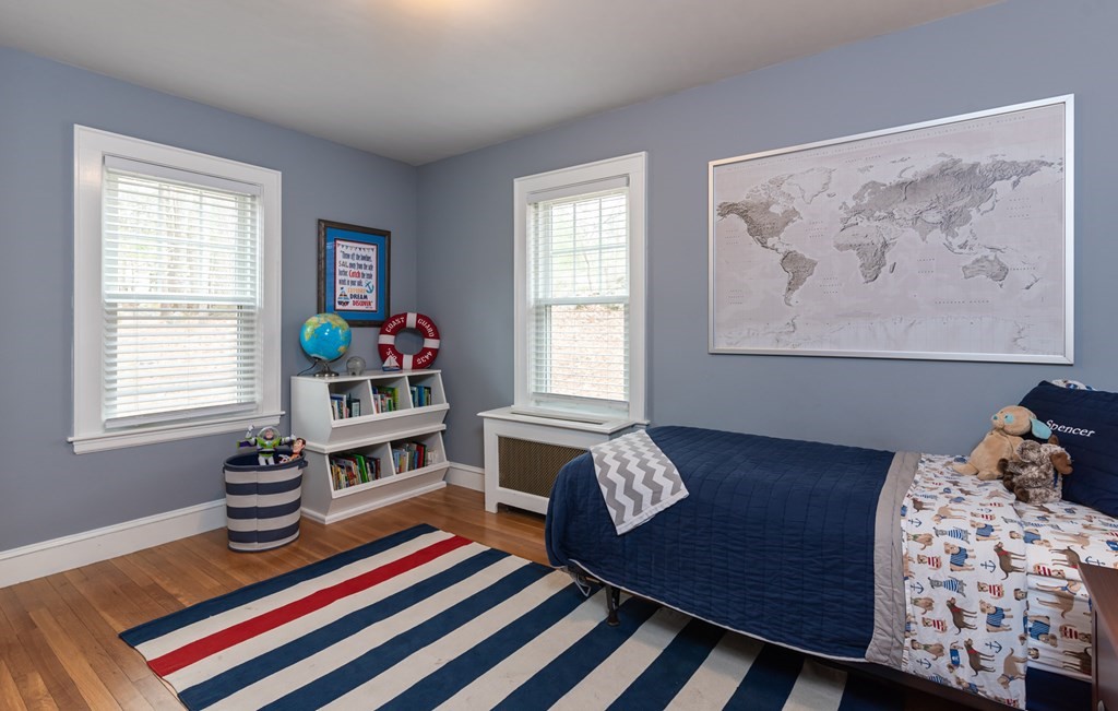 93 Gould Road Andover, MA 01810 - Photo 17 of 39 a bedroom with a bed and wooden floor