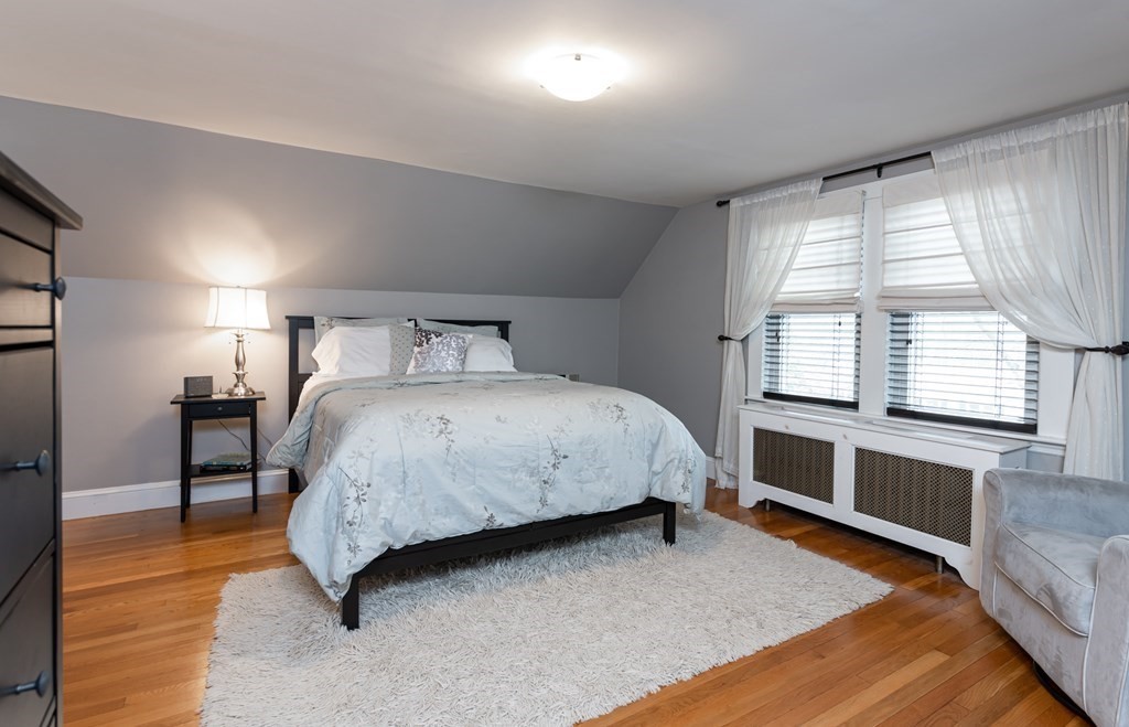 93 Gould Road Andover, MA 01810 - Photo 19 of 39 a spacious bedroom with a bed and a large window