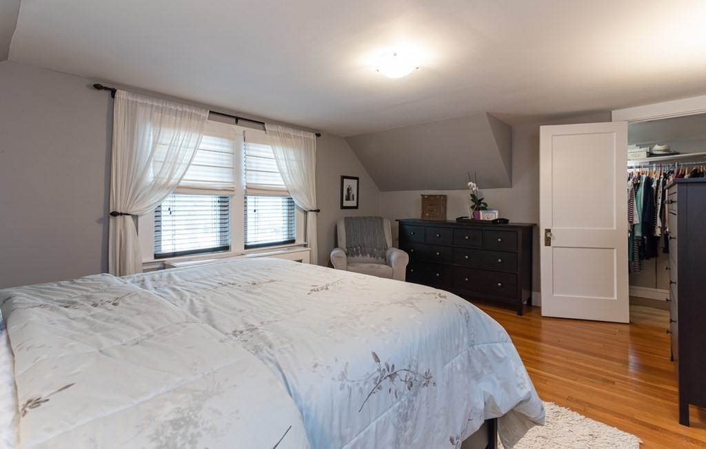 93 Gould Road Andover, MA 01810 - Photo 20 of 39 a spacious bedroom with a bed and wooden floor