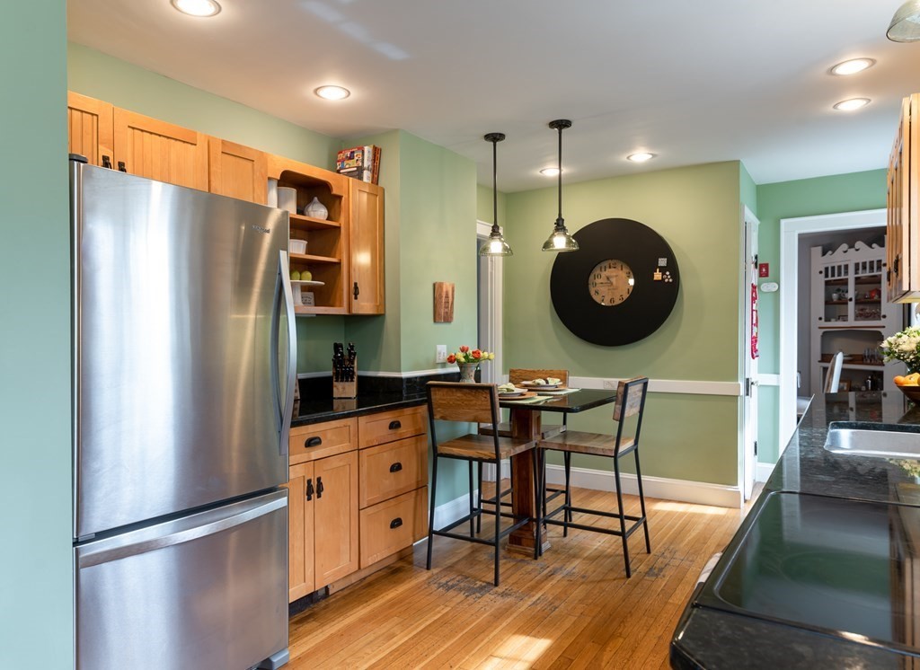 93 Gould Road Andover, MA 01810 - Photo 5 of 39 a kitchen with stainless steel appliances granite countertop a refrigerator and a stove top oven