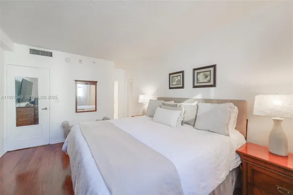 a bed room with a bed and a lamp