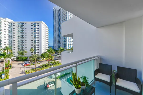 a view of swimming pool and outdoor seating