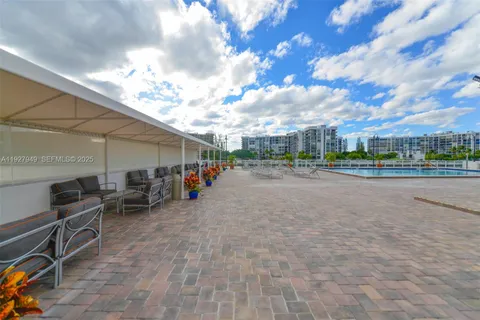 a view of gym equipment and kitchen view