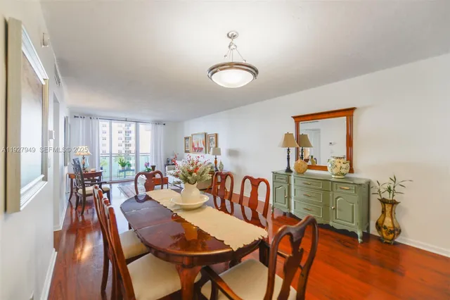 a view of a dining room with furniture window and wooden floor